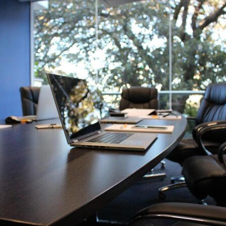 The Requirement for ISO 27001 Certification in the Tendering Process Boardroom Laptop
